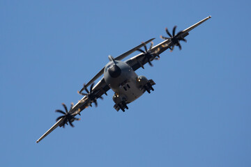 Untitled military transport plane at air base. Airport and airfield. Air force and army flight operation. Aviation and aircraft. Air lift. Military industry. Fly and flying.