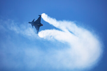 Military fighter jet plane at air base. Airport and airfield. Air force flight operation. Aviation and aircraft. Air defense. Military industry. Fly and flying.