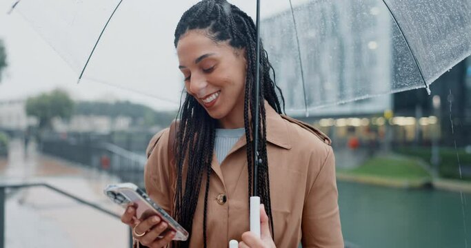 Phone, social media and woman in rain in a city typing in search of outdoor location on internet or app in morning. Winter, umbrella and person on vacation or holiday and chatting with connection
