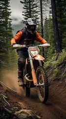 Extreme Sports in Nature:a person riding a orange motorcycle in the forest.