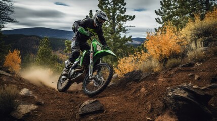 Extreme sports in nature: a person riding a green motorcycle in the mountain