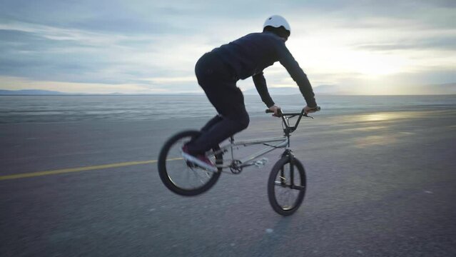 Bike Tricks With Desert Sunset