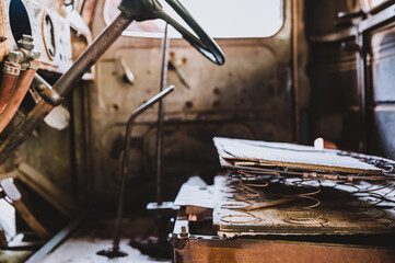 Rusted out springs and interior of an old truck 