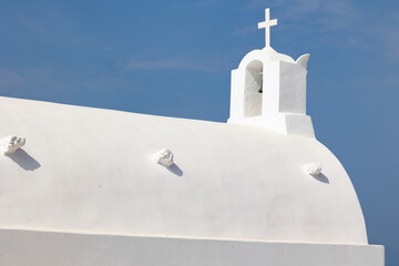 Santorini, Greece - 05 26 2023: The Holy Church of the Assumption of the Virgin in Oia. A famous spot for couples photo shoots