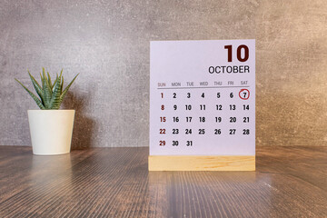 October Month, Appointment date with number cube design for background. Date 7.