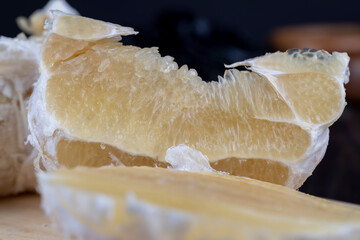 peeled ripe and juicy pomelo close-up, ripe pomelo