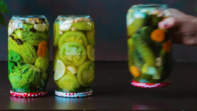 Jars of mixed pickles are placed side by side
