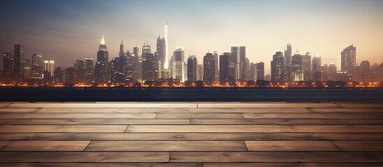 Mock up of blurry skyscrapers as background for empty wooden table top in the evening.