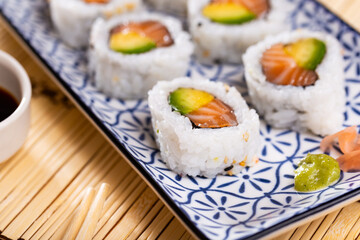 Japanese roll california urumaki with salmon avocado and sesame