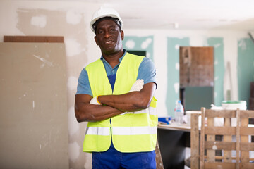 Portrait of confident african-american foreman in a room being renovated
