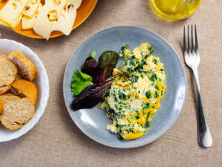 Delicious spinach omelet served on plate for breakfast..