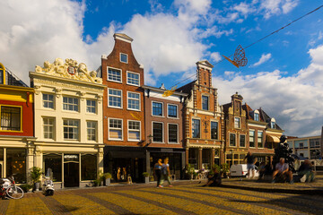 Beautiful buildings of Alkmaar and water canal at sunny day. Netherlands