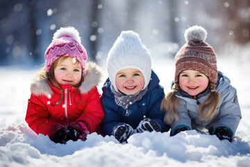 Group of children playing on snow in winter time