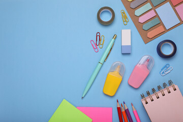 Flat lay composition with different school stationery on light blue background, space for text. Back to school