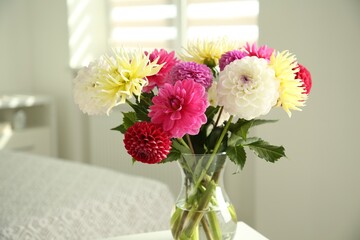 Fototapeta premium Bouquet of beautiful Dahlia flowers in vase at home