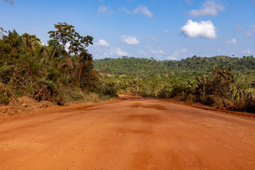 Driving on the famous earth road Transamazonica towards Santarém through the Amazon rainforest in...