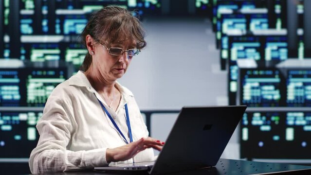 Dilligent inspector in data storage company equipped to handle complex computational operations, doing regular checking on server mainframes, verifying efficiency parameters to prevent damages