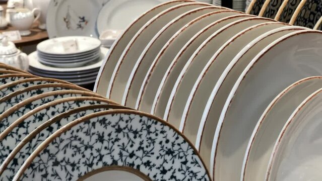 New round plates in the crockery store or tableware shop. Close up