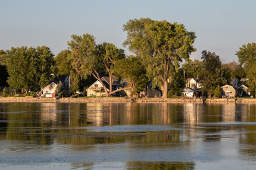 Winnebago Lake Reflections: Serene Skyline and Lakeside Houses