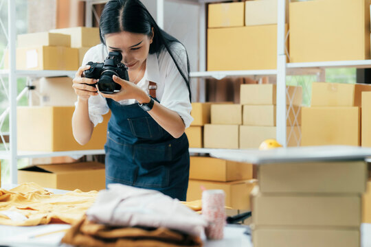 Online sellers use mobile phone to take pictures of product sent to customers..