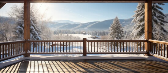 Wooden balcony with winter landscape views in a country house.