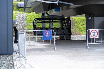 Place of landing in the cabin of the cable car. Close-up of a chairlift cab on the background of mountains and forests. Cable car trip to viewpoints in the mountains. During the trip by cable car.