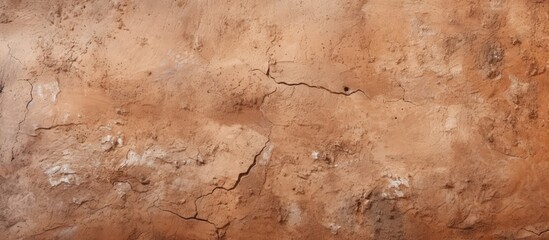 Neutral colors of sand material create a modern house background with a grungy wall texture made of brown clay mud.