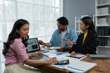 Confident group of asian businessmen working together in office technology creative team brainstorming meeting calculate income graph document internet partner teamwork concept of coworkers.