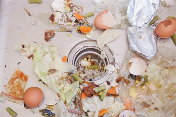 the sink is clogged with food residue. food waste can be used as natural compost
