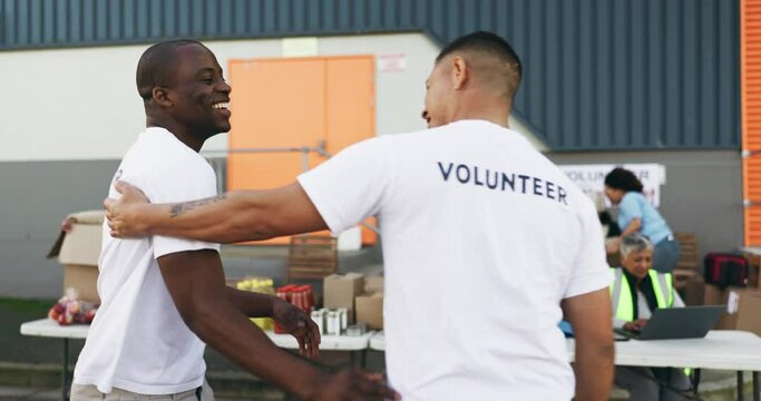 People volunteering, team hug and support for NGO project, nonprofit collaboration and welcome or helping. Men or fiends handshake, love and happy with charity work, donation and community service