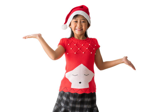 Happy smiling asian child girl in Santa Claus hat with wearing a red Christmas costume, Hold hand surprise standing posing, isolated on white and transparent background