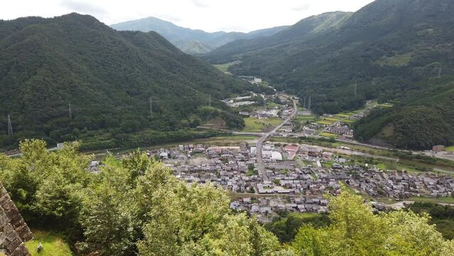 Sprawling panoramic overview of asago valley, japanese village on overcast day