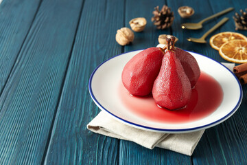 Tasty and delicious food concept - pear in wine