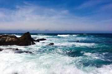 waves crashing on rocky shore in California central coast