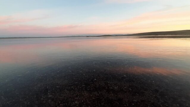 The sunset is reflected in the salt lake Bele, Khakassia