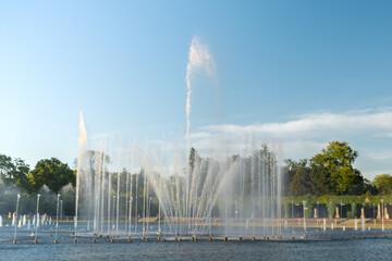 Fototapeta premium Multimedia Fountain at Centennial Hall, Wroclaw, Poland. The biggest fountain in Poland and one of the biggest in Europe. Sunlight water splashes. Beautiful architecture fountain. Travel destination