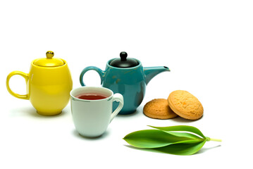 cup of tea and kettle with biscuit , cup of tea and kettle whit bagrund 