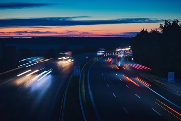 Fotobehang Snelweg bij nacht Traffic on the Highway - Travel - Background - Line - Ecology - Long Exposure - Motorway - Night Traffic - Light Trails - High Quality Photo 