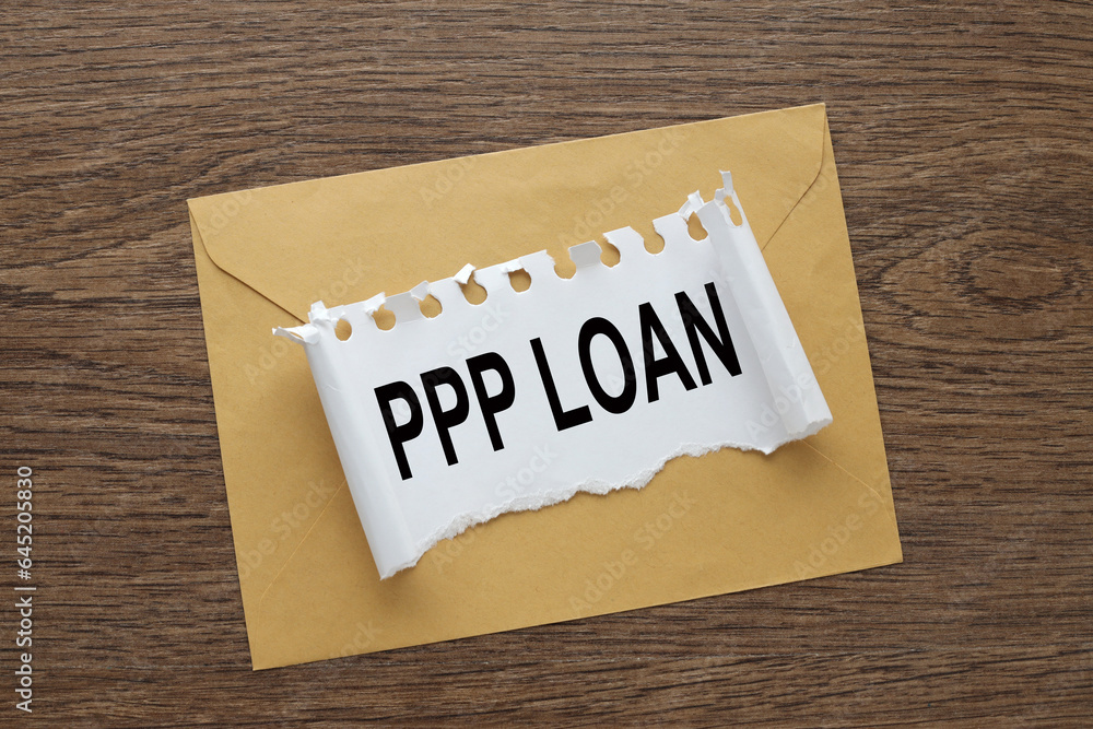 Poster paycheck protection program ppp loan. envelope on the desk.. text on torn paper