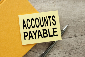 ACCOUNTS PAYABLE. Business concept yellow sticker on a yellow notebook. text on note paper