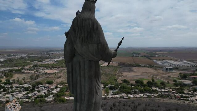 Reveal and aerial view of the Virgen del Valle appreciating the view of the Valle del Fuerte in Los Mochis, Sinaloa, Mexico