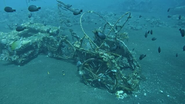 Sunken chariot under the sea at Tulamben Coral Garden, super slow mo