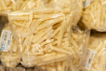 Frozen french fries in a supermarket packaged in a plastic bag