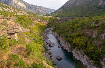 Beautiful view of the deepest Tara River Canyon surrounded by green forest and cliffs with. The most dangerous Moraca Canyon Road in Montenegro, Balkan, Europe