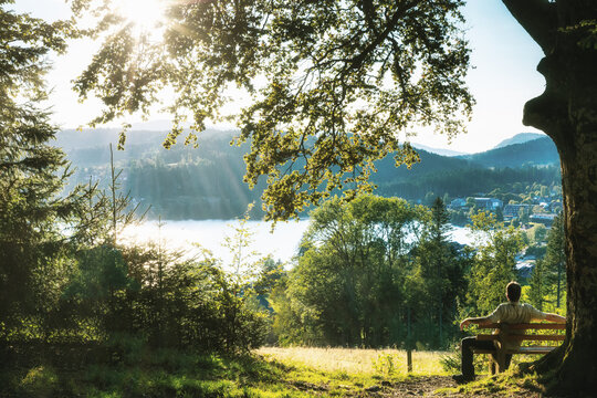 Man on a bench at Titisee in the Black Forest