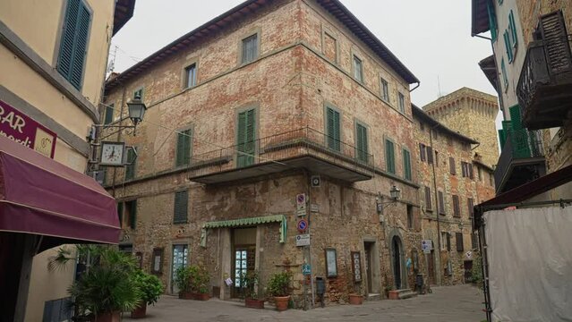 Bars And Restaurants Along Cobbled Street In Lucignano, Arezzo, Italy. dolly-in tilt-up