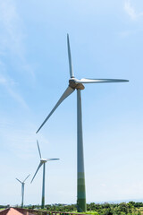 Close-up of wind power systems with a blue sky background on the west coast of Taiwan.