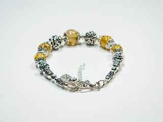 Silver and natural gemstone jewelry on white background