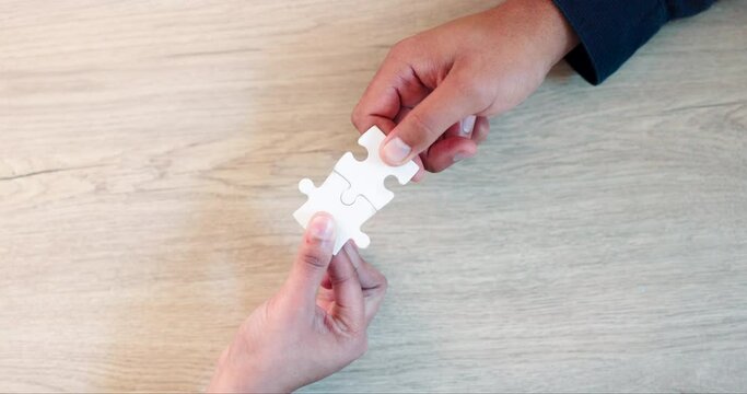 Business, hands or top view of puzzle for problem solving ideas with planning, team building or strategy. Jigsaw, zoom or people meeting for partnership or collaboration with mission or solution