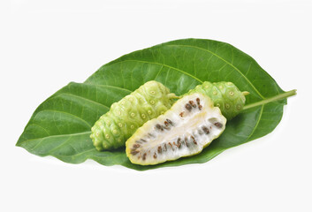 Noni or Morinda Citrifolia fruits with green leaf isolated on white background